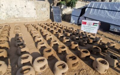 Distributing clay ovens to displaced people living in tents to provide safe cooking methods